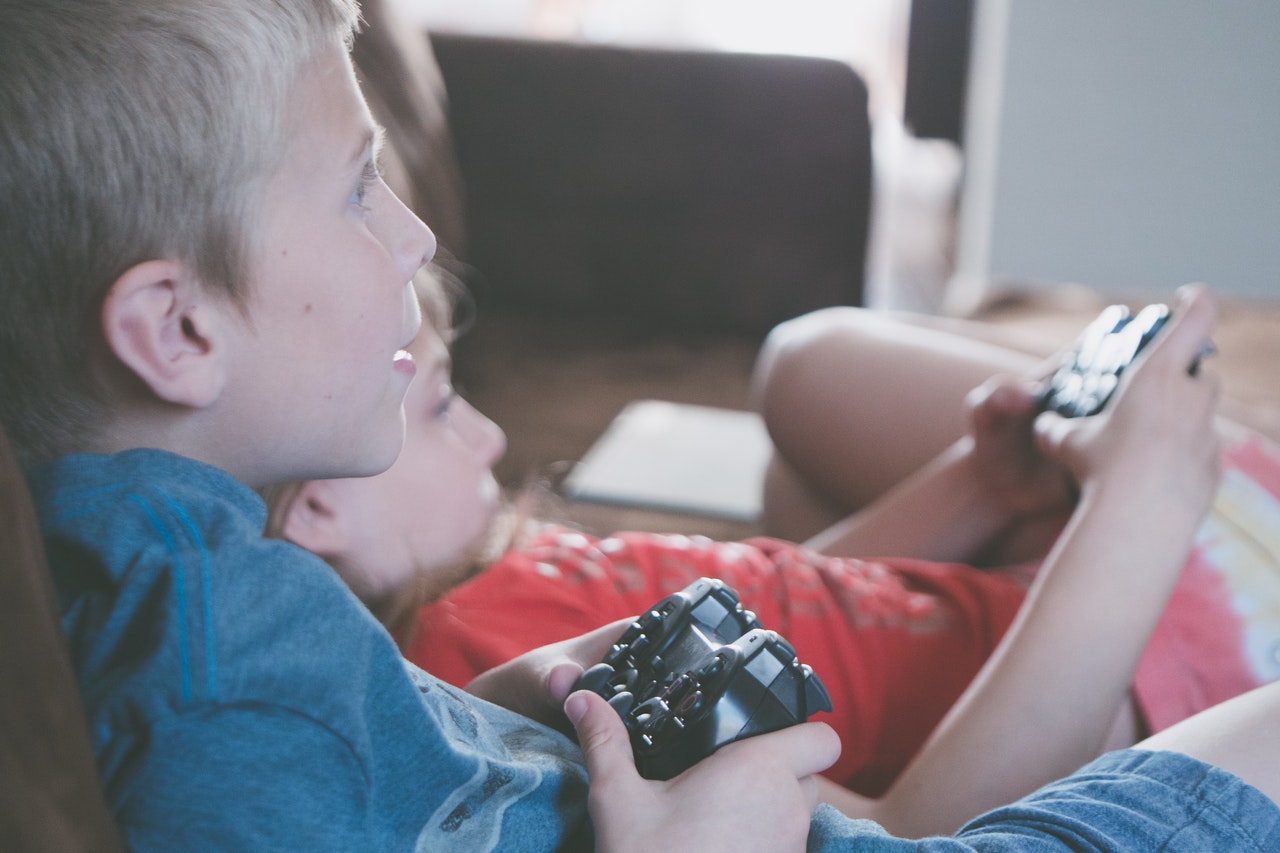 Kids playing gaming console
